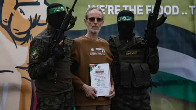 Ohad Ben Ami was one of three Israelis released on Saturday - he is pictured with two masked gunmen