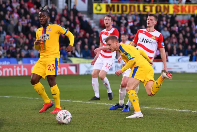 Max Meyer of Crystal Palace scores his team's second goal as team mate Michy Batshuayi (23) looks on during the FA Cup Fifth Round match between Doncaster Rovers and Crystal Palace at Keepmoat Stadium on February 17, 2019.