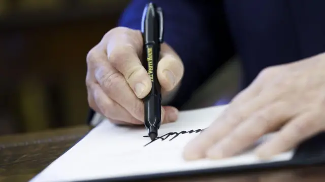 Donald Trump signs an executive order