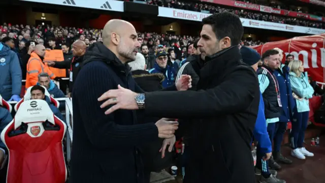 Pep Guardiola and Mikel Arteta shaking hands