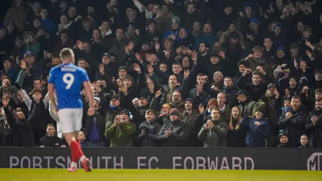 Colby Bishop celebrates in front of the Portsmouth fans