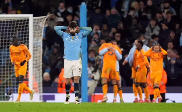 Gvardiol puts his hands to his head as Madrid players celebrate