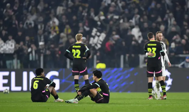 PSV players sit defeated on the floor at full time