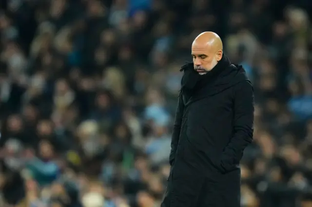 Pep Guardiola puffs out his cheeks in frustration