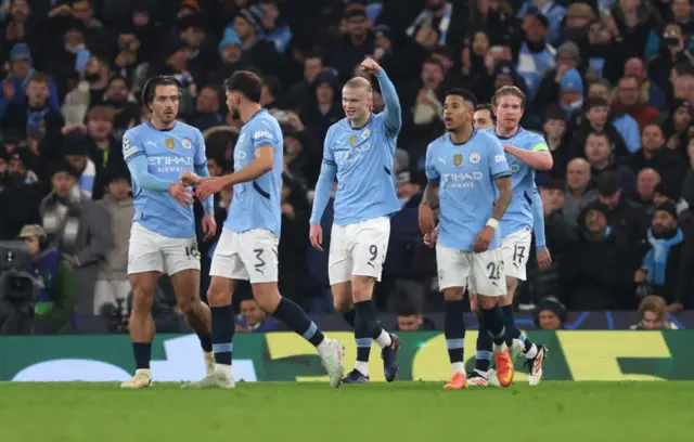 Haaland celebrates his goal v Madrid with teammates