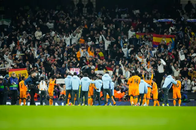 Real Madrid players celebrate with their fans at the end