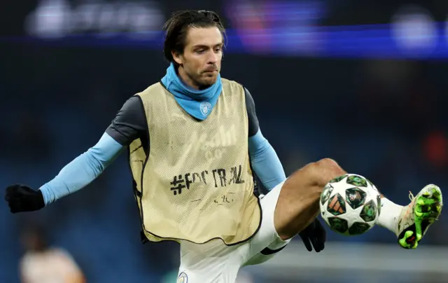 Grealish controls a ball in the warm up