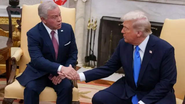 King Abdullah shakes hands with President Trump