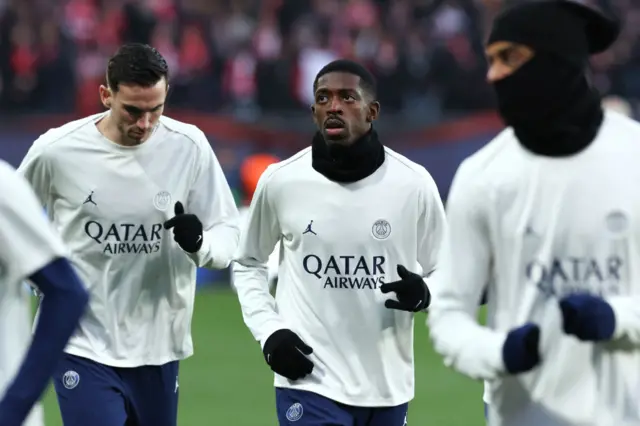 Dembele and teammates warm up for PSG