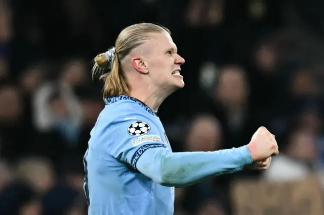 Haaland celebrates his second goal v madrid by shaking his fists