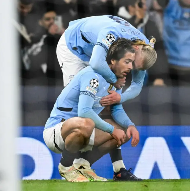 Grealish is hugged by Haaland after creating the goal