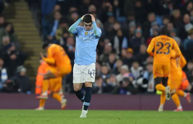 Foden puts his hands to his head in disbelief after Madrid's winner