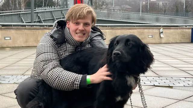 Oliver King with his pet dog, Sky.