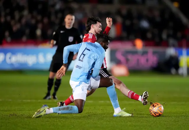 Nottingham Forest's Ibrahim Sangare (left) and Exeter City's Ed Francis (right)