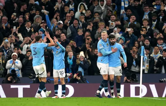 City players celebrate with Haaland after his opener