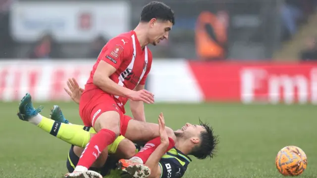 Man City midfielder Nico Gonzalez is challenged by Leyton Orient's Sonny Perkins