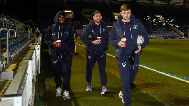 Portsmouth players Christian Saydee, Callum Lang and Zak Swanson arrive at Fratton Park