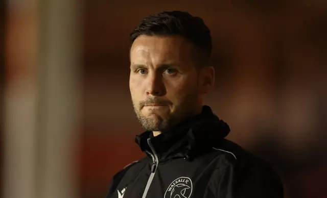 Walsall boss Mat Sadler looks pensive on the touchline