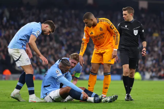 Akanji sits on the floor