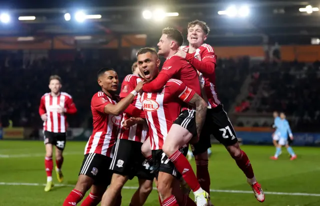 Josh Magennis celebrates