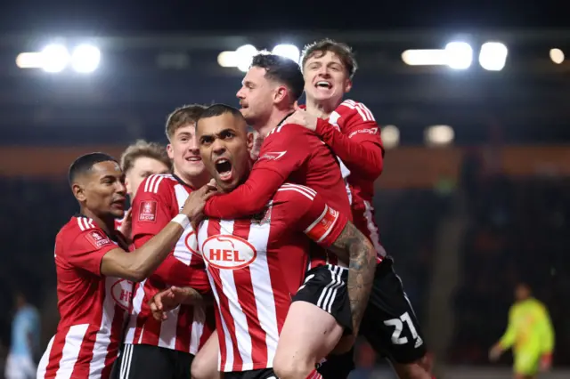 Josh Magennis celebrates