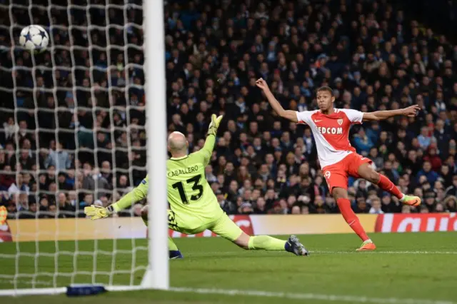 Mbappe slots the ball high past Caballero during a UCL match for Monaco against Man City in 2017