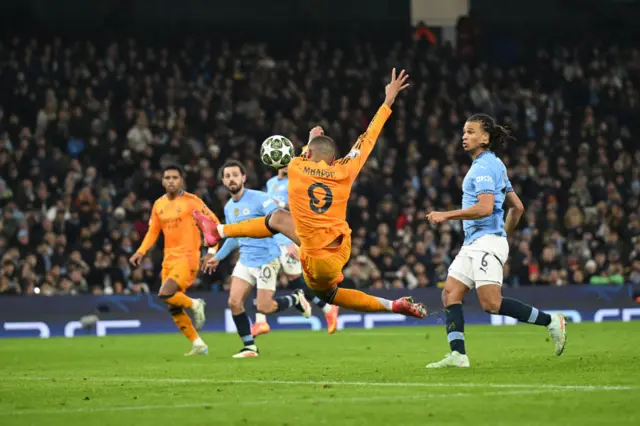 Mbappe watches the ball bobble in past Ederson