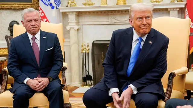 Donald Trump and Jordan's King Abdullah sit on chairs in the Oval Office