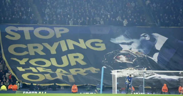 A banner of Rodri banner kissing the ballon d'or