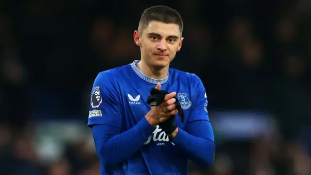 Everton defender Vitaliy Mykolenko applauds fans