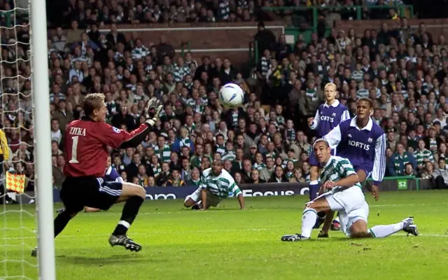 The teenage Vincent Kompany looks on as Henrik Larsson heads Celtic into an early lead