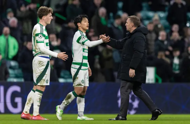 Celtic manager Brendan Rodgers with Reo Hatate and Arne Engels