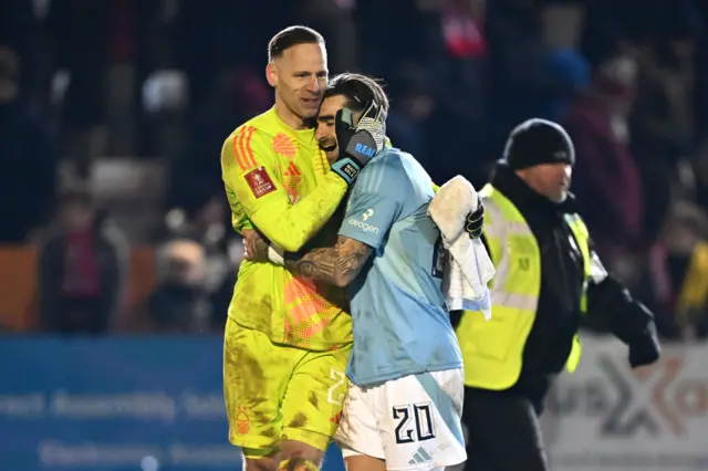 Matz Sels and Jota Silva hug