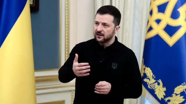 Zelensky gestures as he speaks