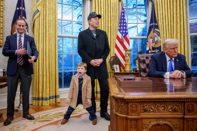 Elon Musk and his son pose alongside Trump