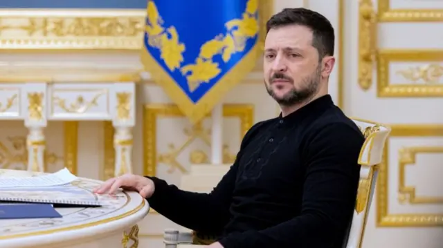 Ukrainian President Volodymyr Zelensky sits in the presidential palace.