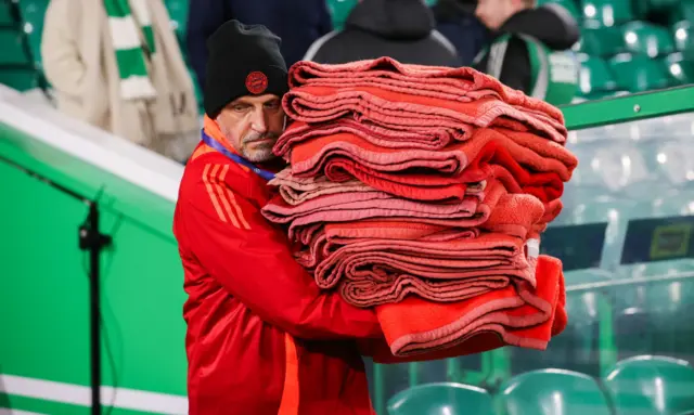 Bayern Munich blankets are borught to the bench