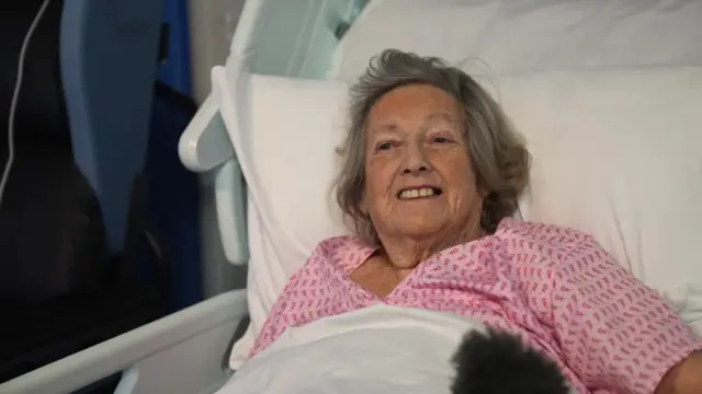 Angela in hospital bed