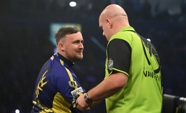 Luke Littler and Michael van Gerwen shake hands