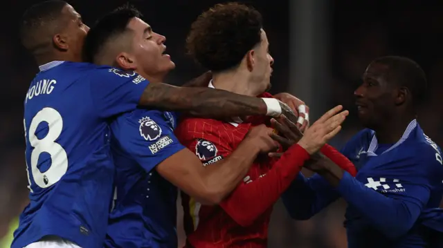 Everton's Abdoulaye Doucoure and Liverpool's Curtis Jones get into an altercation