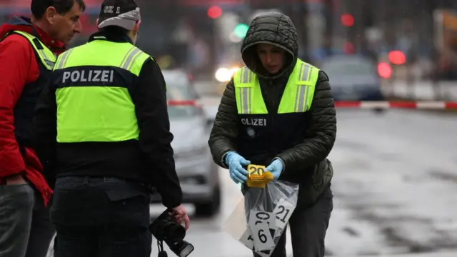 Three police officers gather evidence