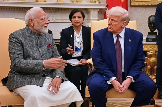 Modi sits with President Donald Trump