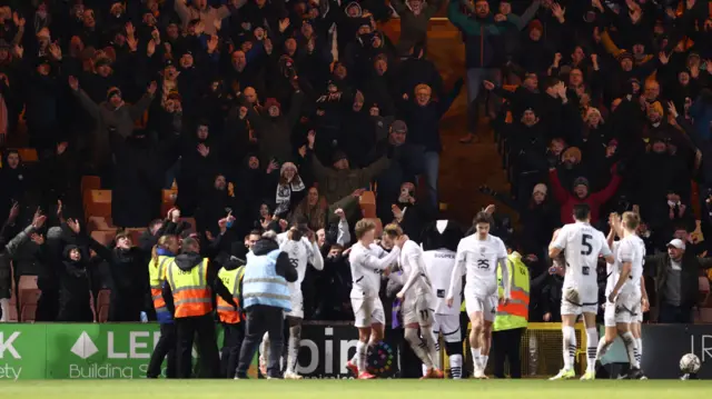 Port Vale celebrate Ronan Curtis' goal in front of their fans