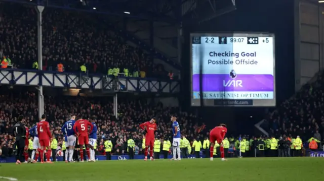 A VAR message for a possible offside is displayed on the big screen following a goal by James Tarkowski of Everton