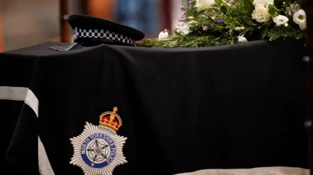 PC Prior's coffin with her police helmet on top of it