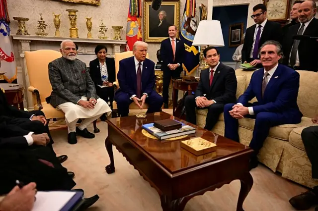 Modi sits with President Trump at the White House