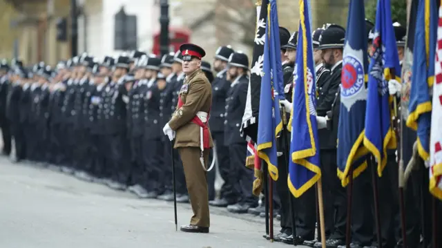 Police and flagbearers line the cortege route to York Minster ahead of the funeral of Police constable Rosie Prior.