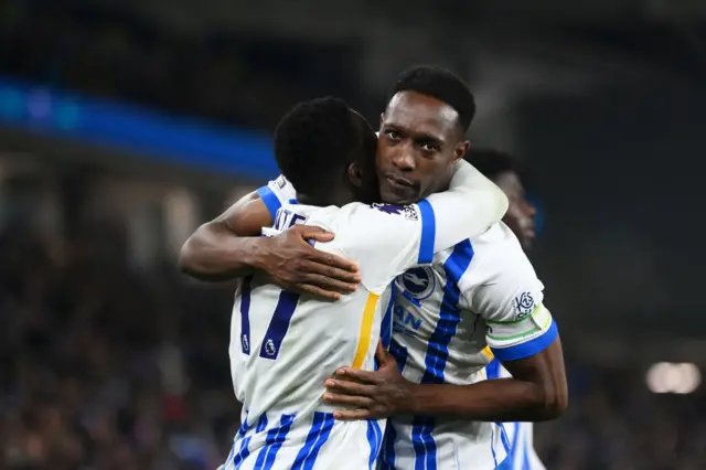 Danny Welbeck hugs Yankuba Minteh