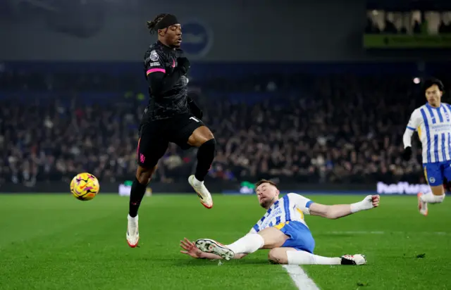 Chelsea's Noni Madueke in action with Brighton & Hove Albion's Adam Webster