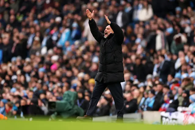 Pep Guardiola, Manager of Manchester City, reacts